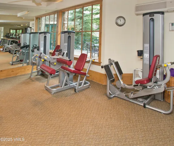 a living room with furniture and wall painting