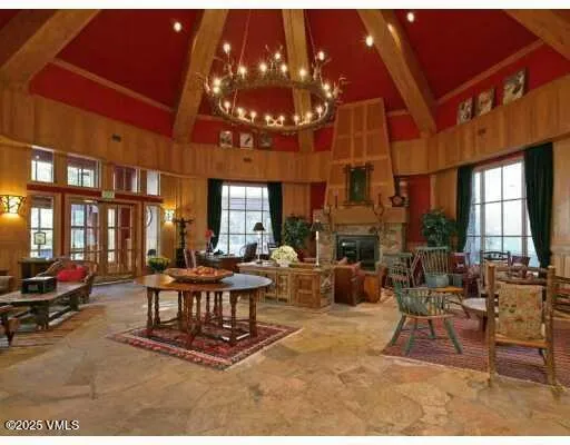 a view of a swimming pool with outdoor seating