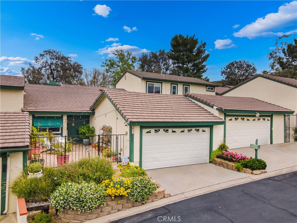 2671 Condor Circle Corona, CA 92882 - Photo 1 of 44 a front view of a house with garden