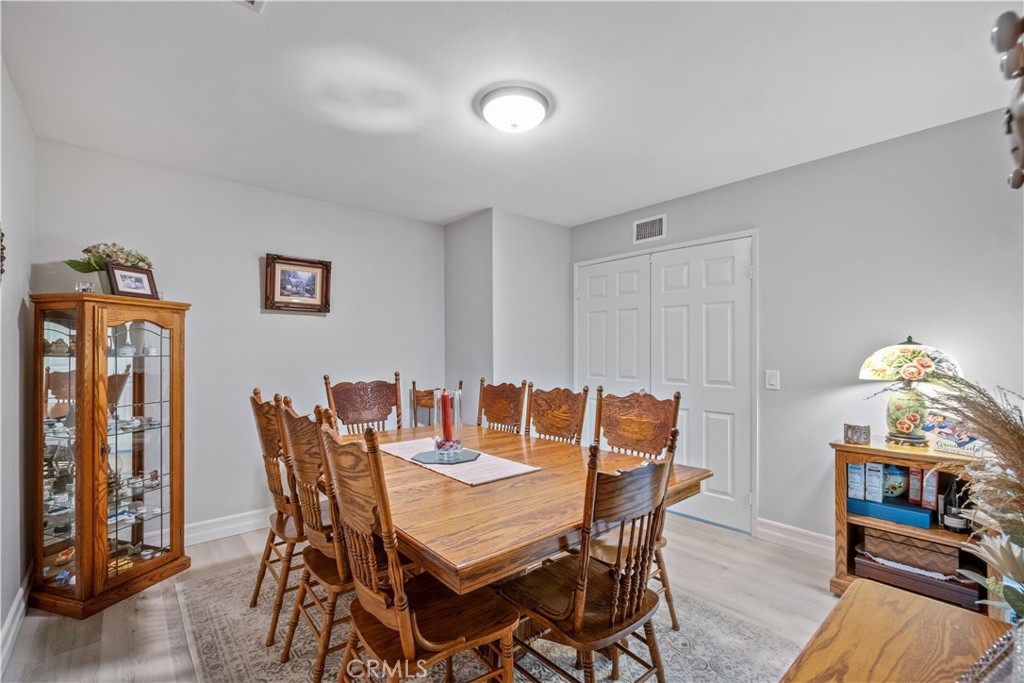 2671 Condor Circle Corona, CA 92882 - Photo 12 of 44 a view of a dining room with furniture and wooden floor