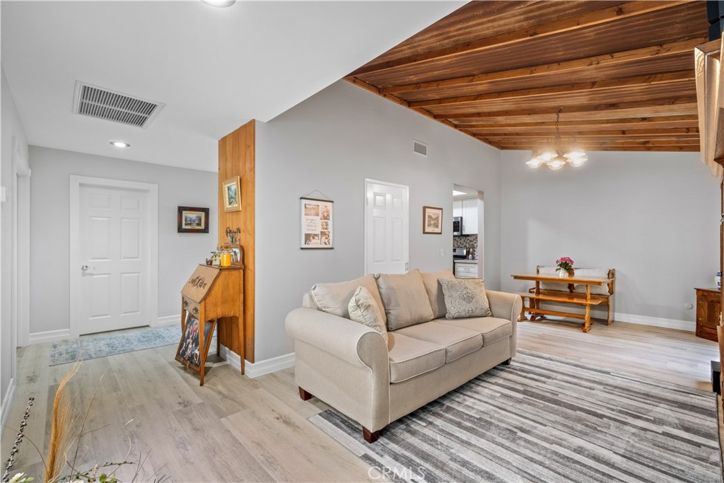 2671 Condor Circle Corona, CA 92882 - Photo 14 of 44 a living room with furniture and a wooden floor