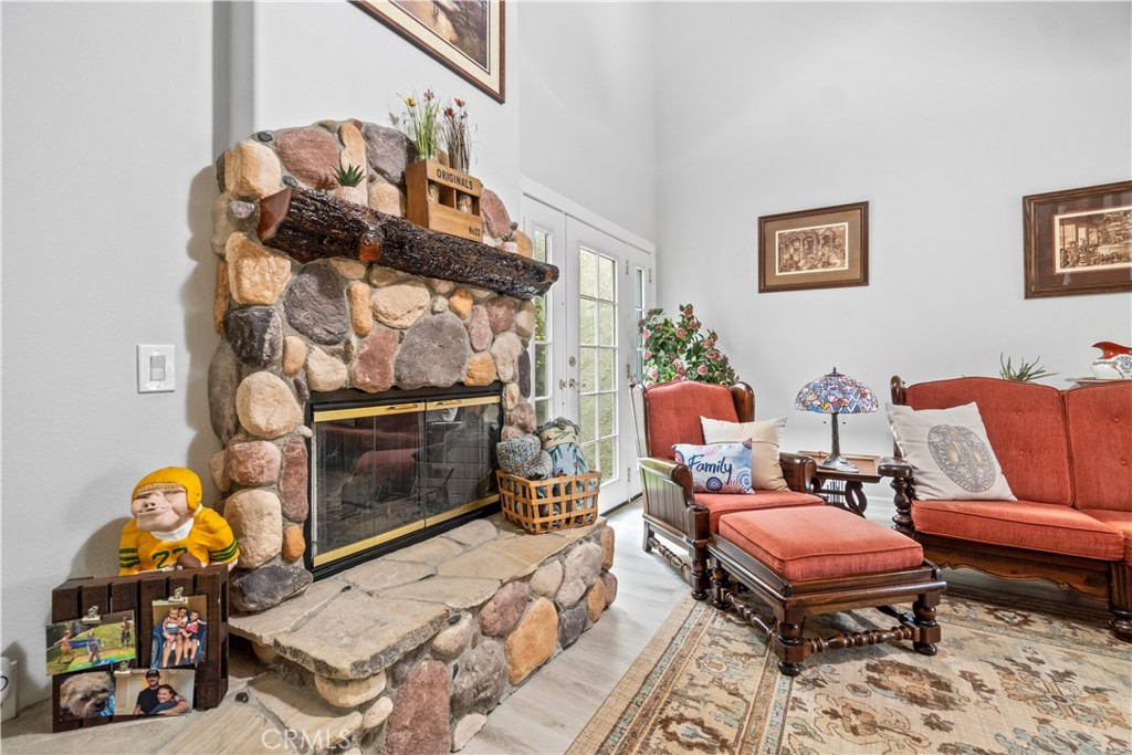 2671 Condor Circle Corona, CA 92882 - Photo 21 of 44 a living room with furniture a rug and a fireplace