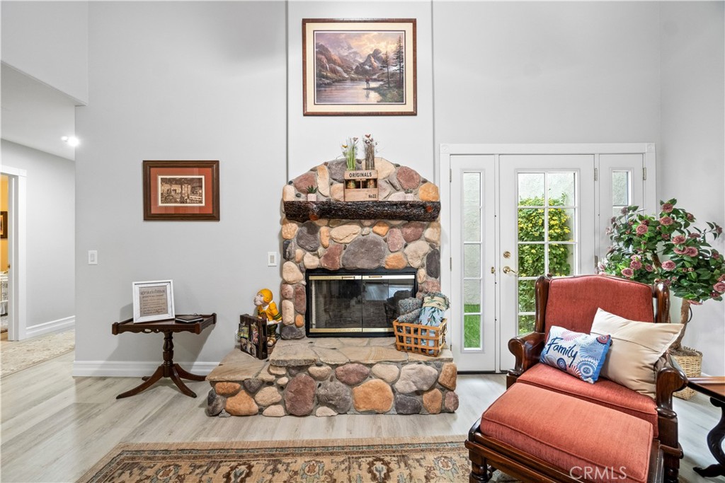 2671 Condor Circle Corona, CA 92882 - Photo 22 of 44 a living room with furniture a window and a fireplace