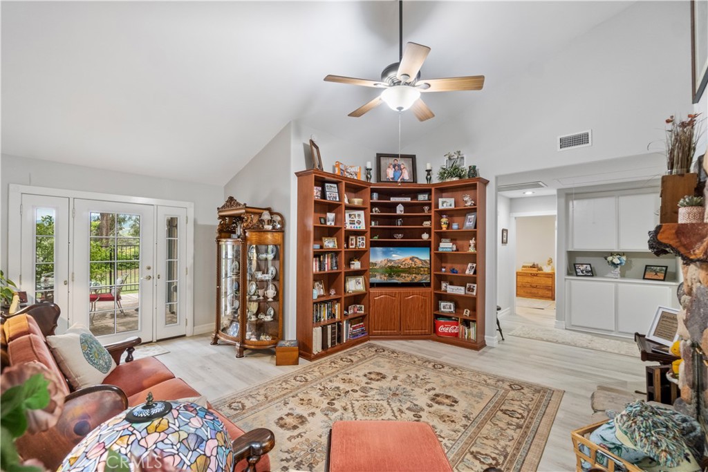 2671 Condor Circle Corona, CA 92882 - Photo 23 of 44 a living room with furniture and wooden floor