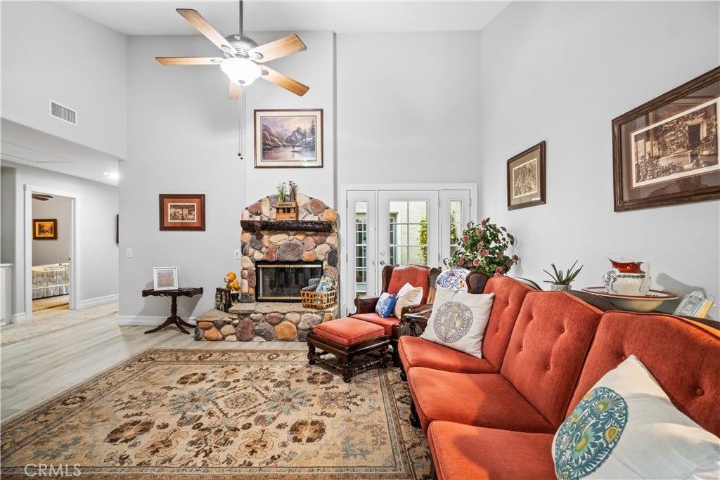 2671 Condor Circle Corona, CA 92882 - Photo 26 of 44 a living room with furniture a couch and dresser