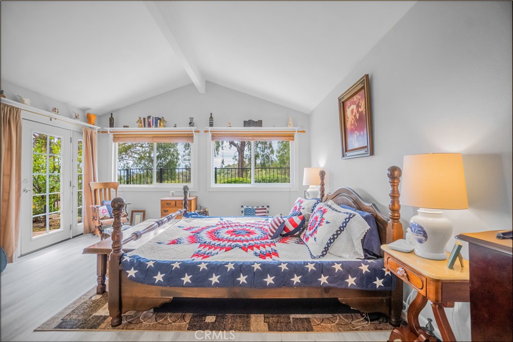 2671 Condor Circle Corona, CA 92882 - Photo 30 of 44 a bedroom with a bed and wooden floor