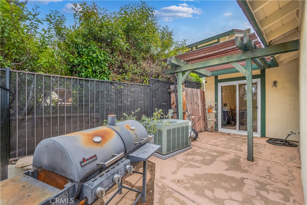 2671 Condor Circle Corona, CA 92882 - Photo 40 of 44 a view of a chair and tables in the patio