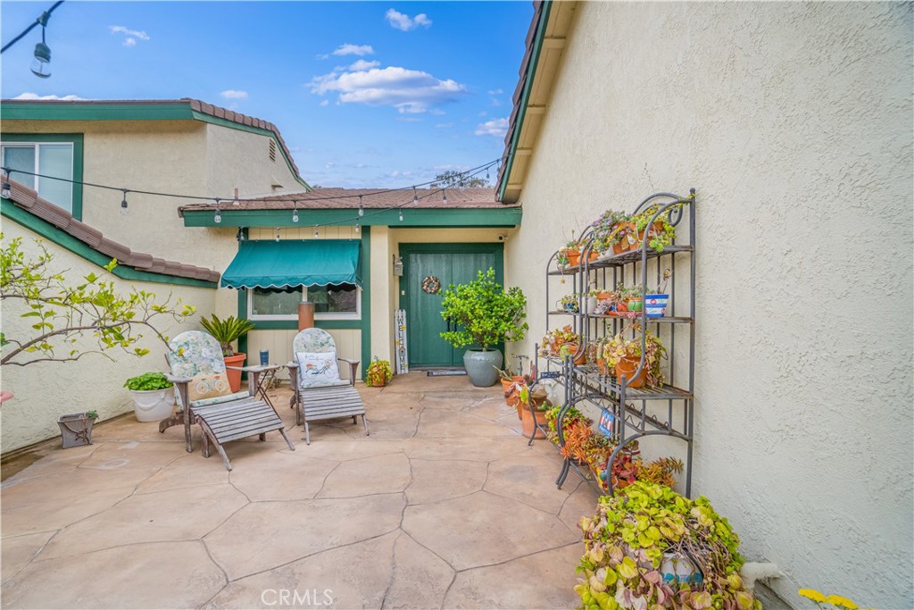 2671 Condor Circle Corona, CA 92882 - Photo 5 of 44 a outdoor space with lots of potted plants