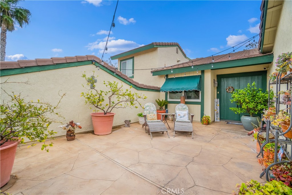 2671 Condor Circle Corona, CA 92882 - Photo 6 of 44 a front view of a house with outdoor seating