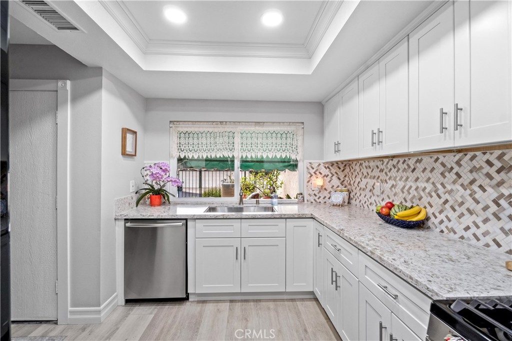 2671 Condor Circle Corona, CA 92882 - Photo 9 of 44 a kitchen with a sink and cabinets