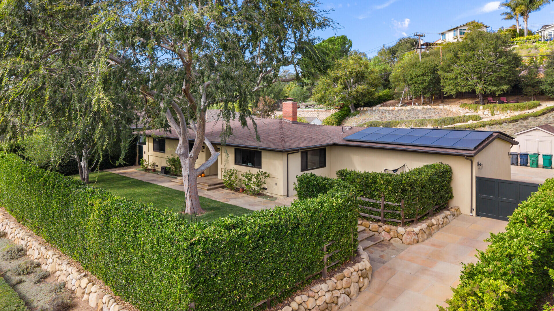 654 Chalk Hill Road Solvang, CA 93463 - Photo 2 of 30 a front view of a house with garden