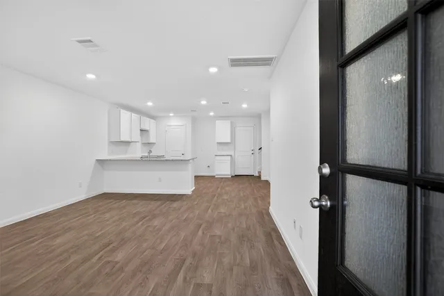 a view of kitchen with refrigerator and window