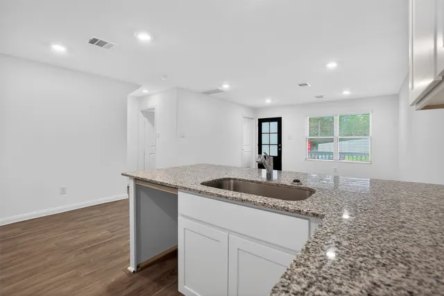 a kitchen with sink and window