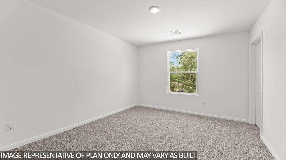 11806 Holly Hurst Drive Willis, TX 77378 - Photo 9 of 11 an empty room with a window