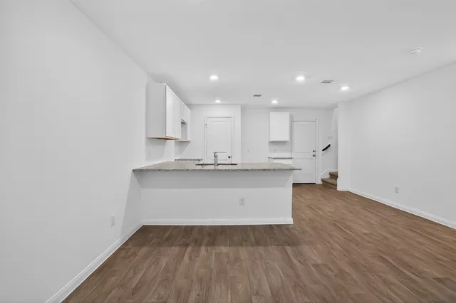 a view of kitchen with wooden floor