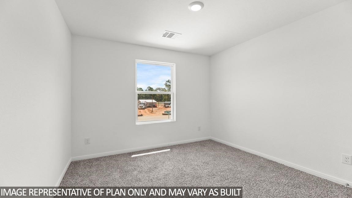 11806 Holly Hurst Drive Willis, TX 77378 - Photo 10 of 11 a view of an empty room and window