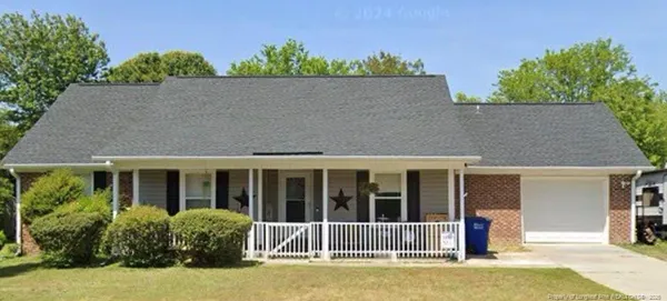 front view of a house with a garden