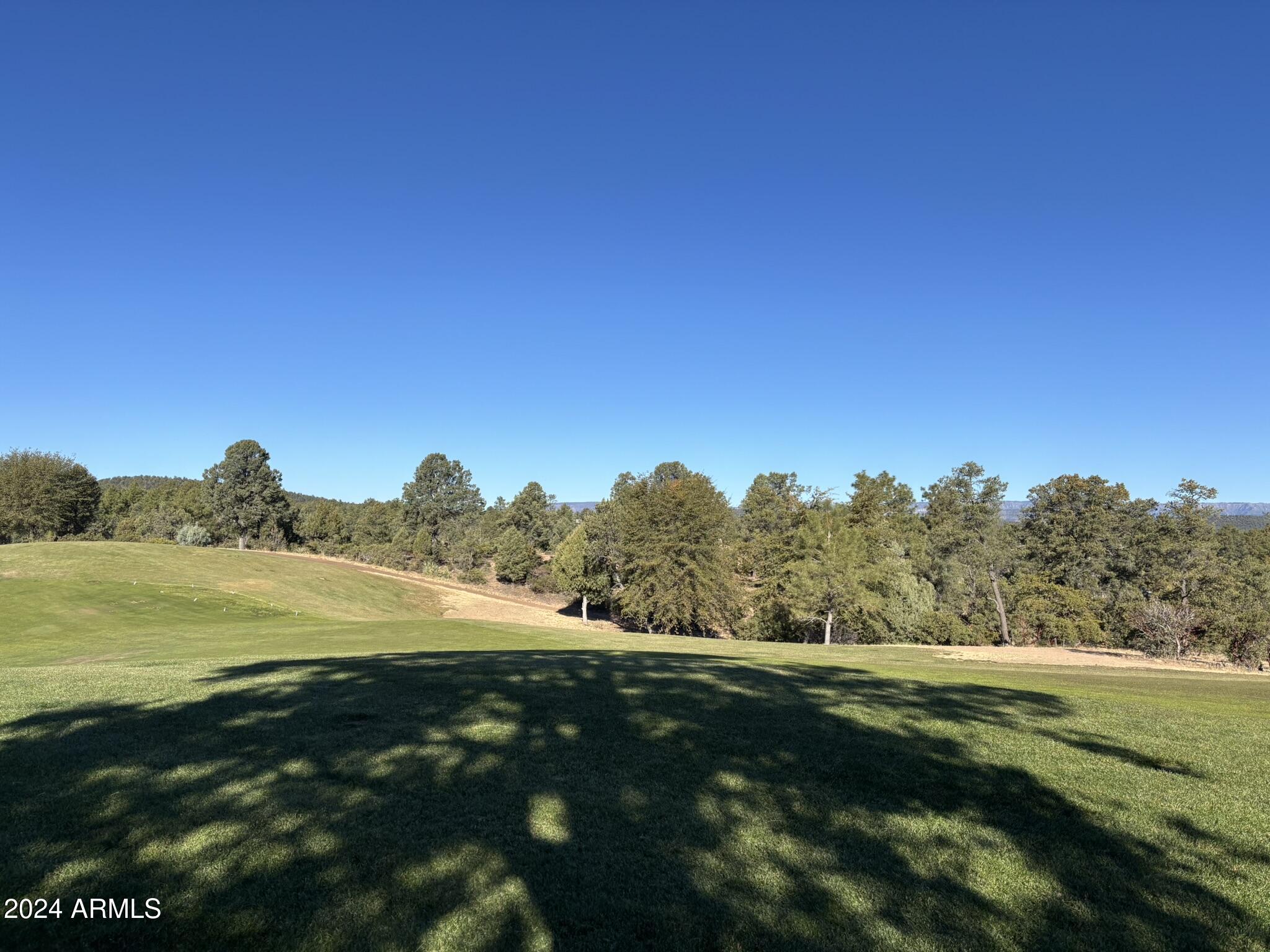 2502 East Rim Club Drive, Unit 118 Payson, AZ 85541 - Photo 13 of 17 a view of an ocean and beach