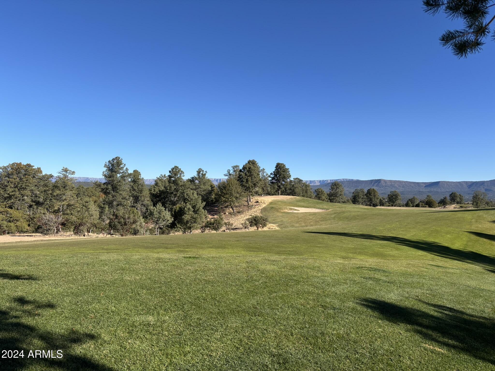 2502 East Rim Club Drive, Unit 118 Payson, AZ 85541 - Photo 5 of 17 a view of an ocean and beach