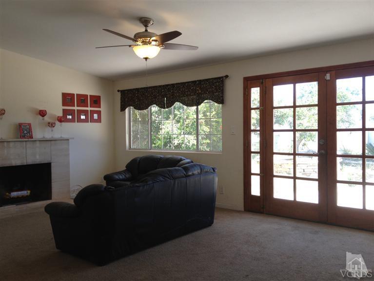 3230 Madera Place Oxnard, CA 93033 - Photo 3 of 9 a living room with furniture and a fireplace