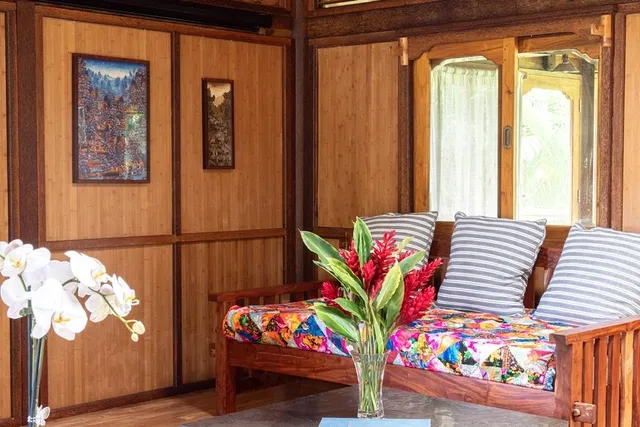 a front view of a bedroom with garden and furniture