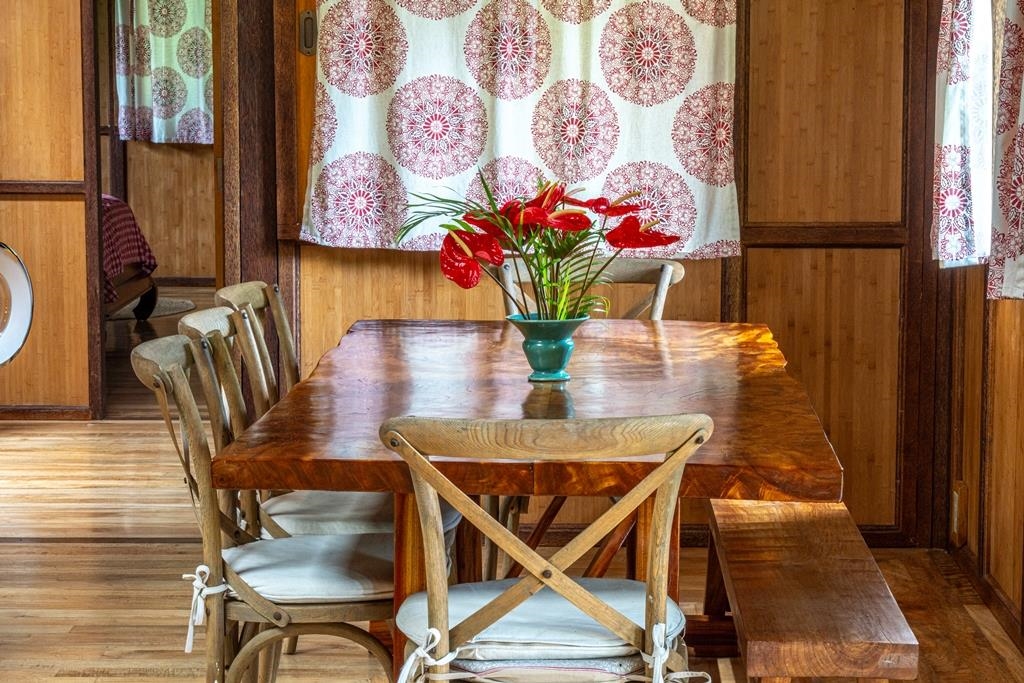 165 Waikoloa Road Hana, HI 96713 - Photo 12 of 50 a dining room with furniture and wooden floor