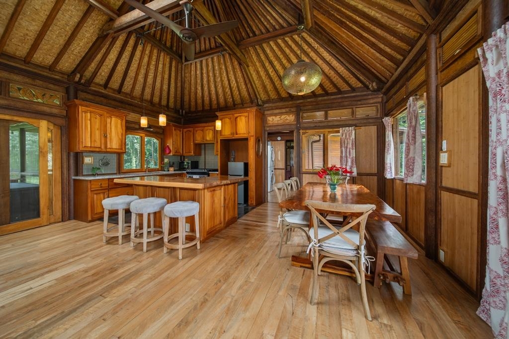 165 Waikoloa Road Hana, HI 96713 - Photo 13 of 50 a dining room with furniture and wooden floor