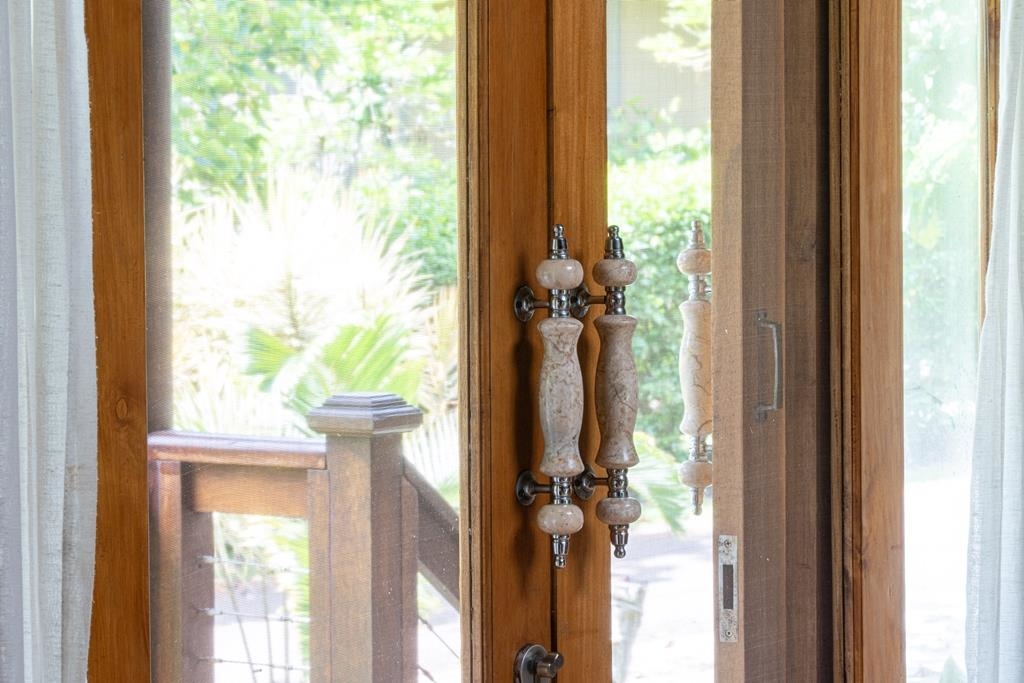 165 Waikoloa Road Hana, HI 96713 - Photo 22 of 50 a view of a porch with a potted plant and floor