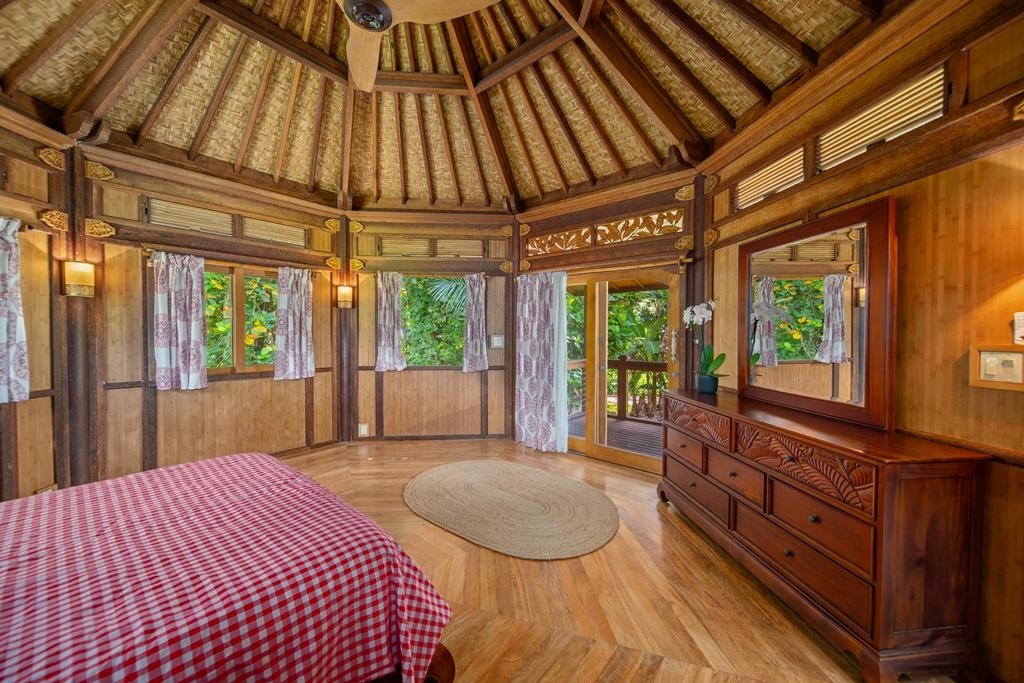 165 Waikoloa Road Hana, HI 96713 - Photo 29 of 50 a bedroom with a large bed and a window