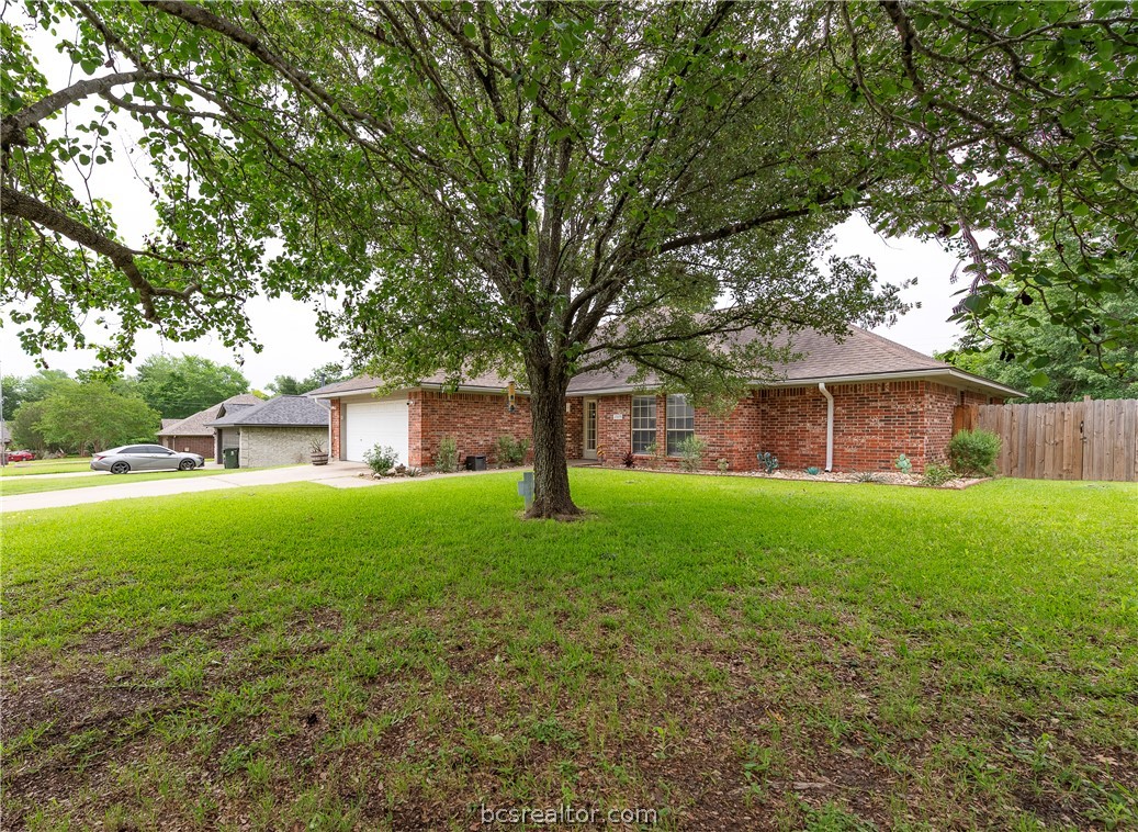 2009 Cobblestone Lane Bryan, TX 77807 - Photo 2 of 23 a view of a house with yard and tree s