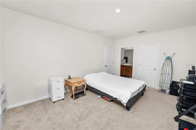 a room with a bed and furniture