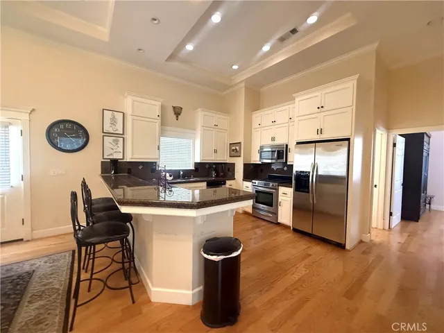 a living room with a couch and a chandelier