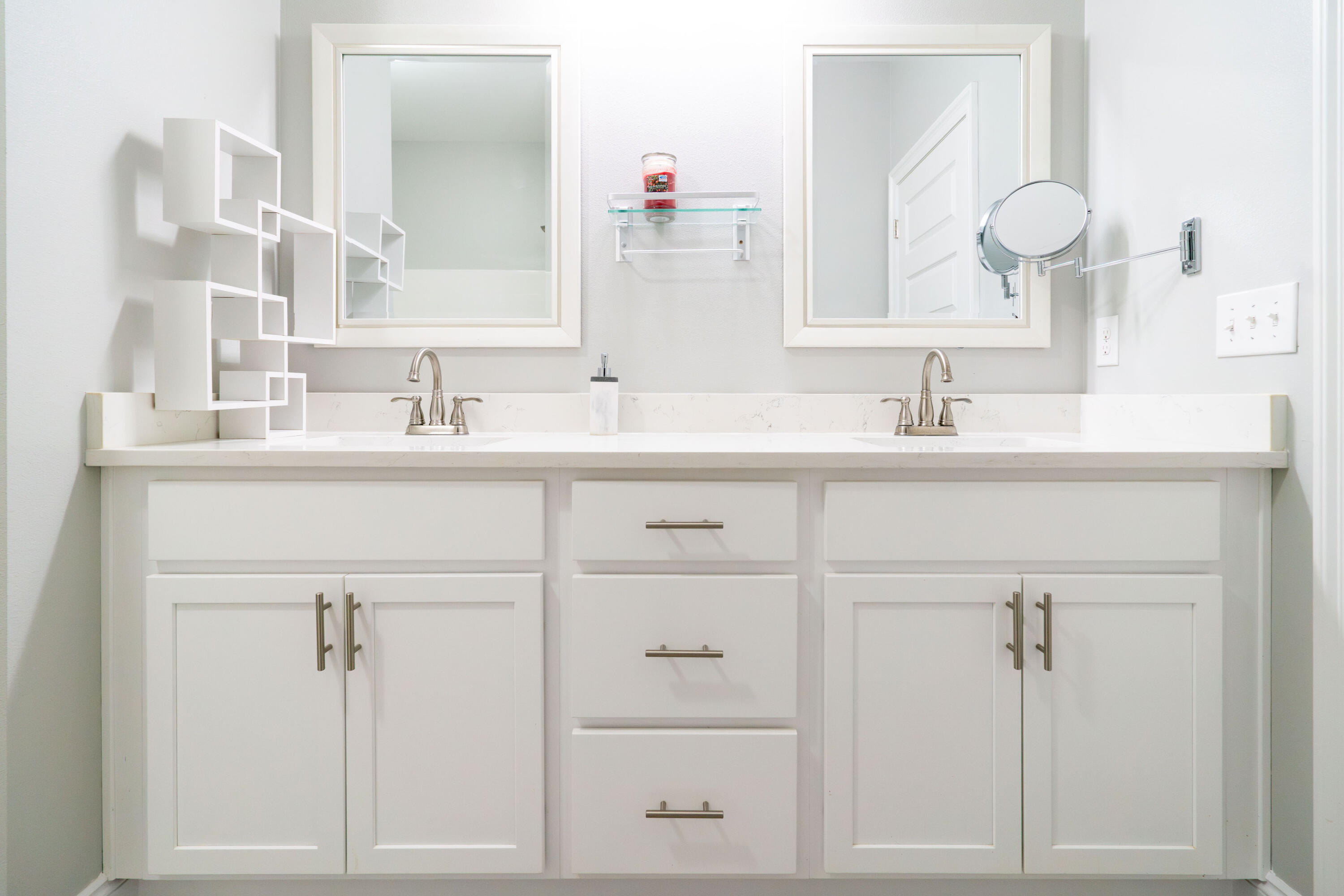 2243 Wind Trace Road North Navarre, FL 32566 - Photo 19 of 34 a bathroom with a sink vanity and mirror