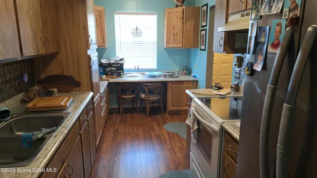 a white toilet sitting next to a sink