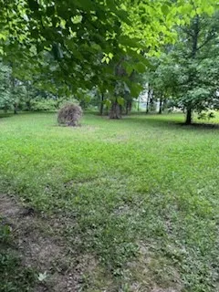 a view of outdoor space with deck and yard