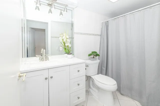 a bedroom with a bed and a desk