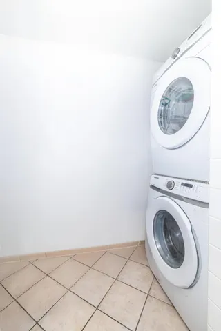 a kitchen with granite countertop white cabinets and appliances