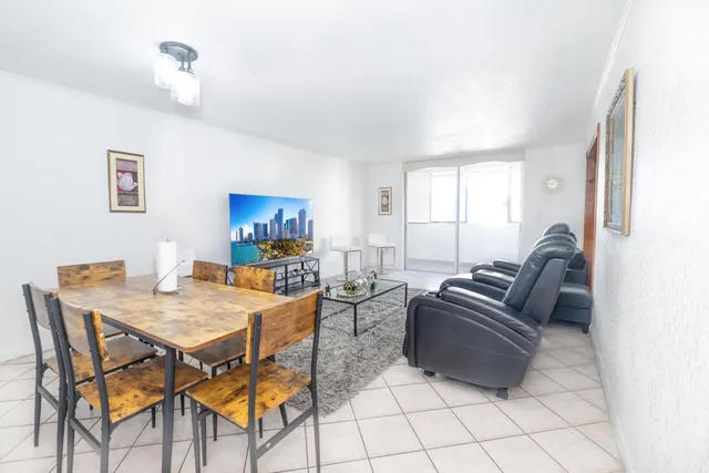 a living room with furniture and a table