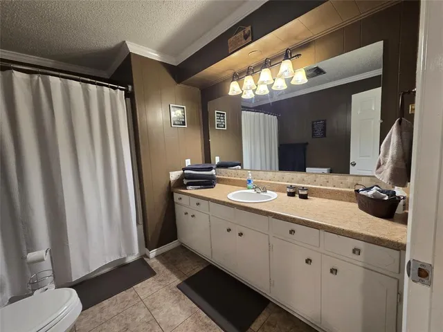 a bathroom with a double vanity sink and mirror