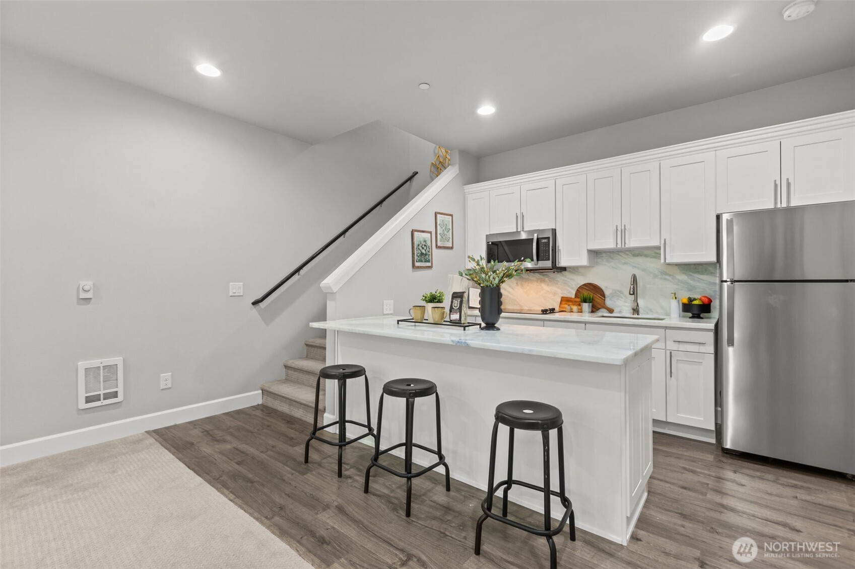 18231 3rd Drive Southeast Bothell, WA 98012 - Photo 31 of 40 a kitchen with stainless steel appliances a dining table chairs refrigerator and sink