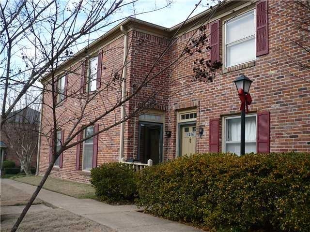 1214 Bristol Drive, Unit 1214 Memphis, TN 38119 - Photo 1 of 11 front view of a house with a dry yard