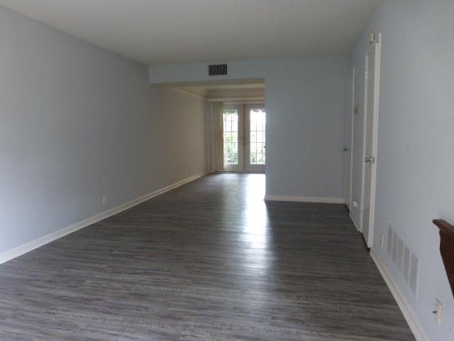 1214 Bristol Drive, Unit 1214 Memphis, TN 38119 - Photo 4 of 11 a view of wooden floor and windows in a room