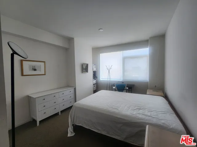 a bathroom with a double vanity sink toilet and shower