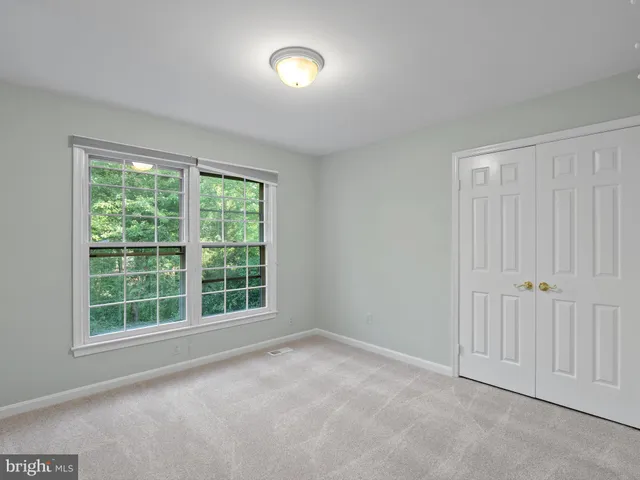 a bathroom with a sink vanity granite and a mirror