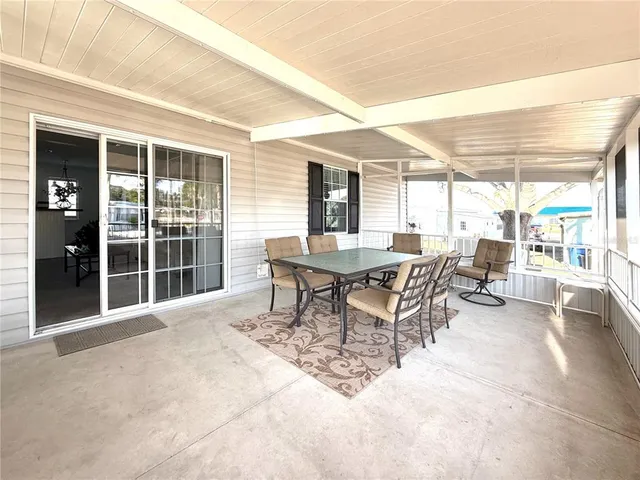 a dining room with a table and chairs