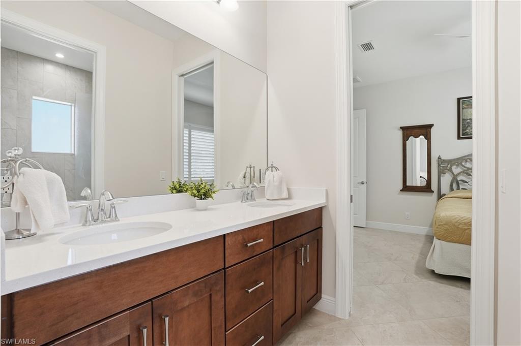 3707 5th Avenue Southwest Naples, FL 34117 - Photo 23 of 45 2nd Bathroom connected t o 2nd & 2rd bedrooms featuring double vanity and private water closet and shower