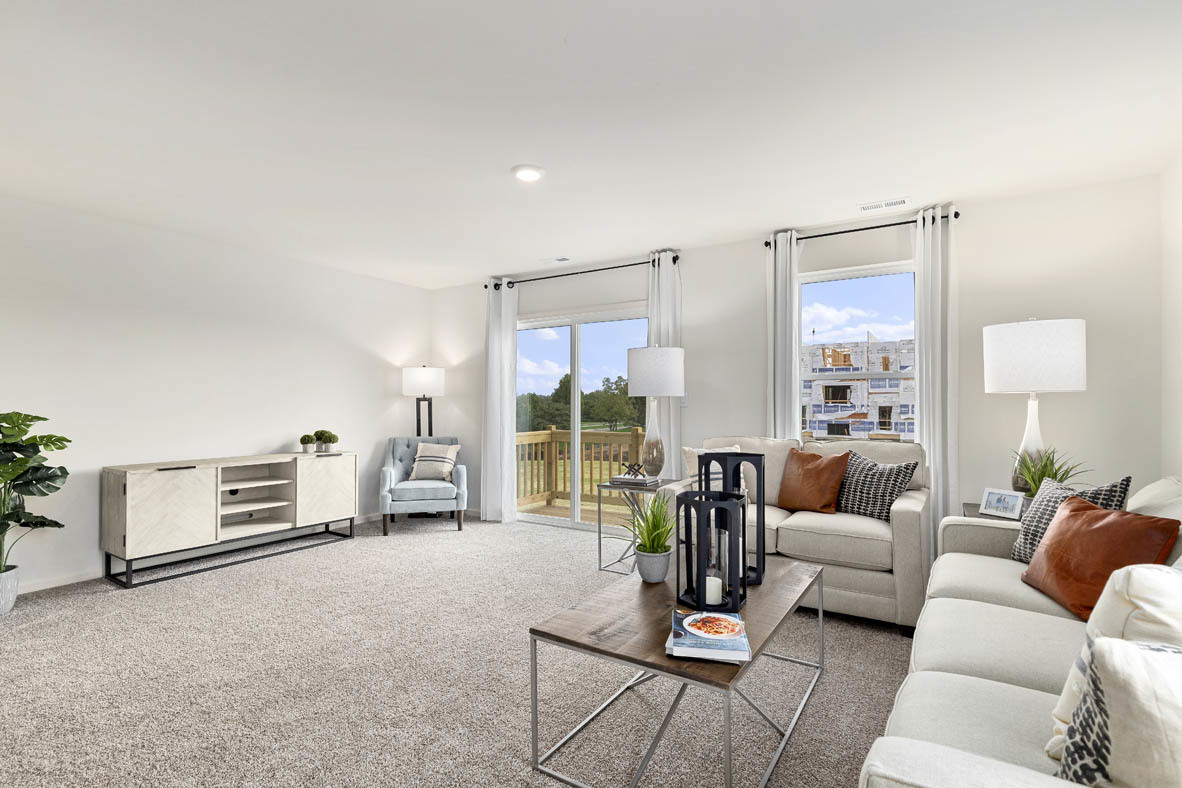 2121 Sassafras Way, Unit E Wonder Lake, IL 60097 - Photo 13 of 51 a living room with furniture and a flat screen tv