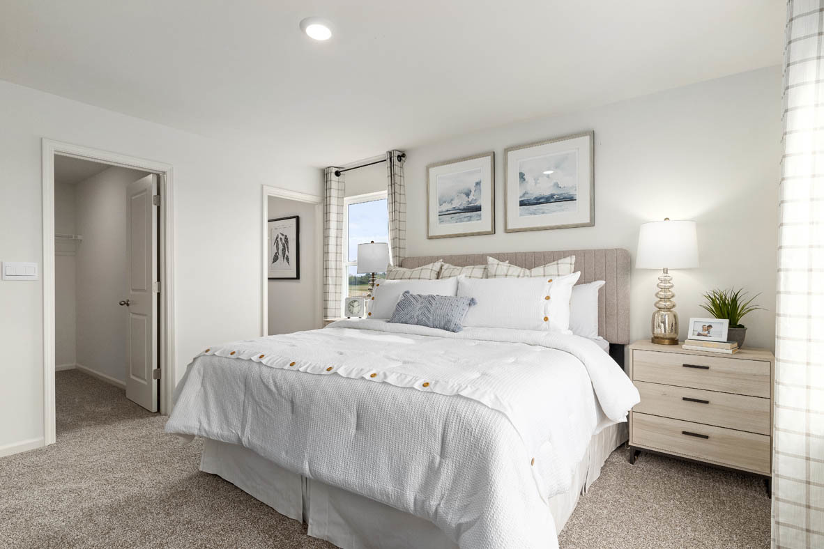 2121 Sassafras Way, Unit E Wonder Lake, IL 60097 - Photo 25 of 51 a bedroom with a bed and a night stand