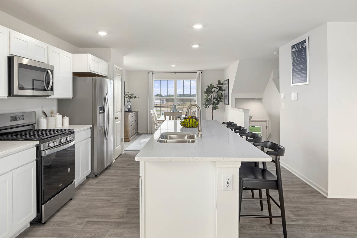 2121 Sassafras Way, Unit E Wonder Lake, IL 60097 - Photo 8 of 51 a kitchen with a stove a refrigerator and a refrigerator