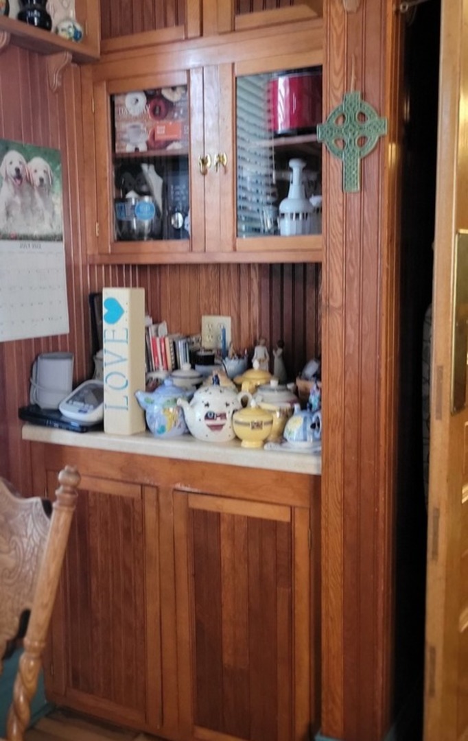 103 North Maple Street Momence, IL 60954 - Photo 19 of 43 a kitchen with a sink and a stove with wooden floor